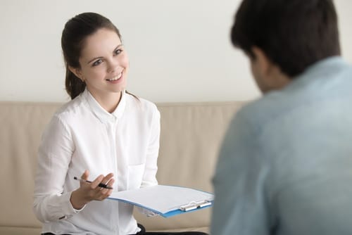 Picture of woman speaking to man