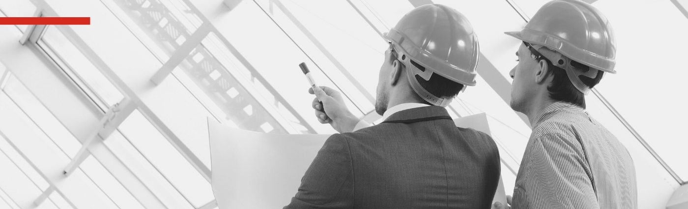 Two people looking at a construction site.